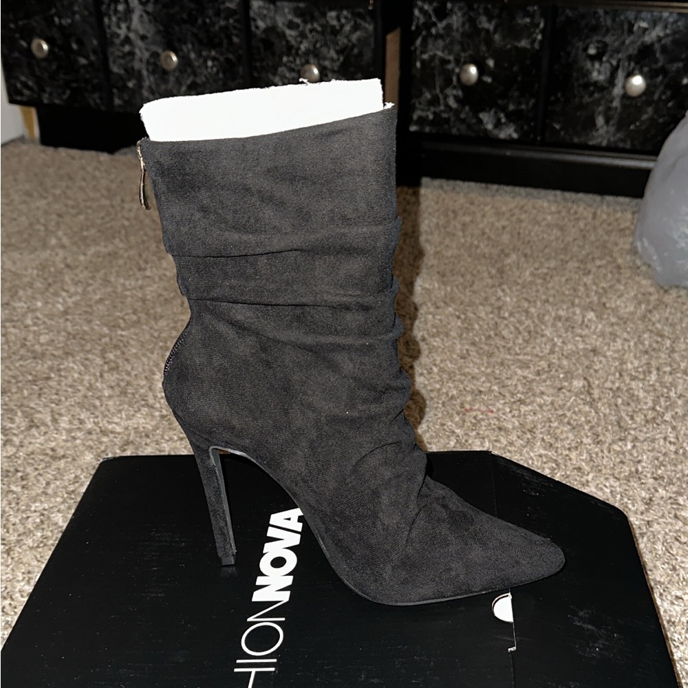 Brand new Black heel boots. Never worn